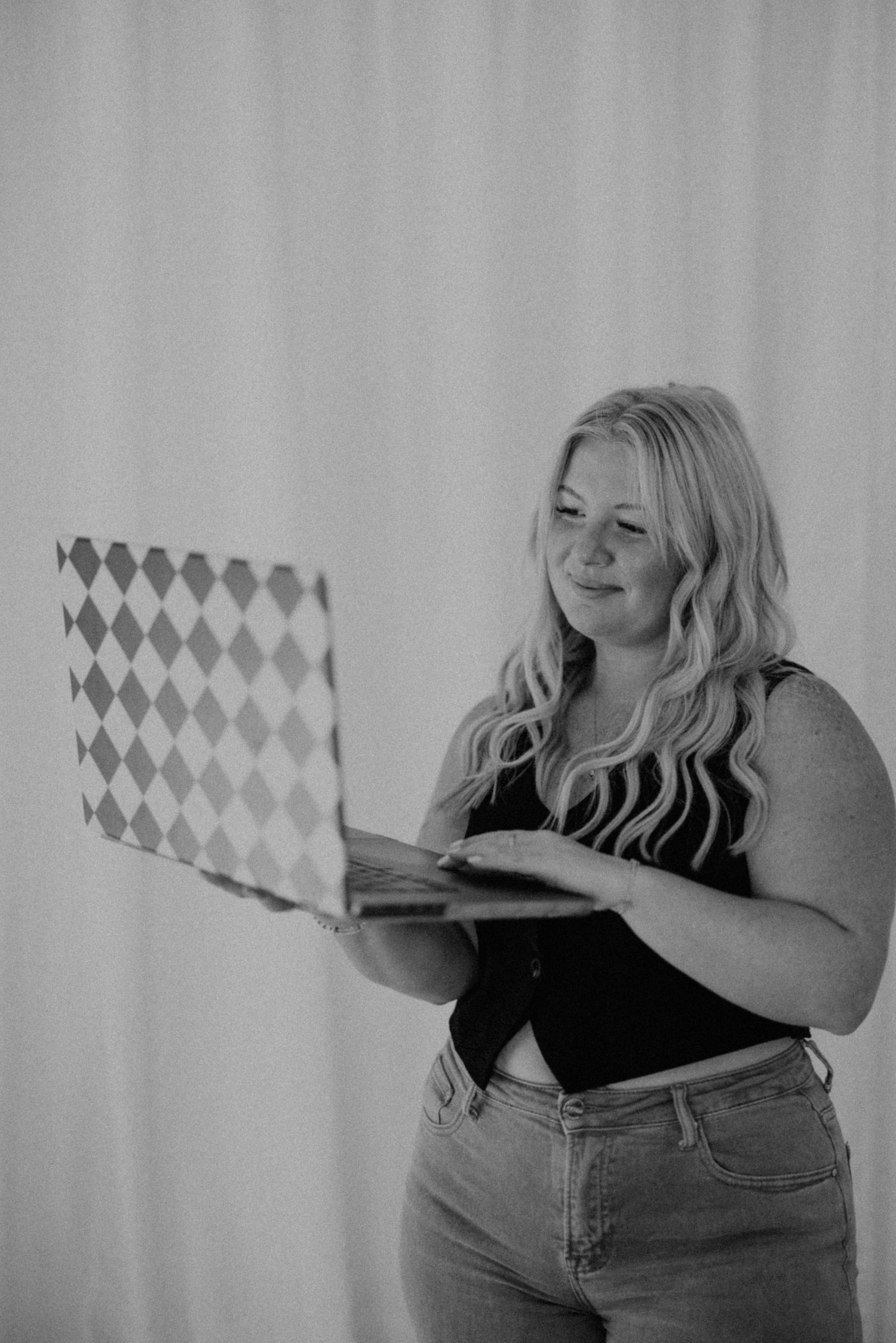 Casual portrait series against white wall showing playful expressions and relaxed poses.