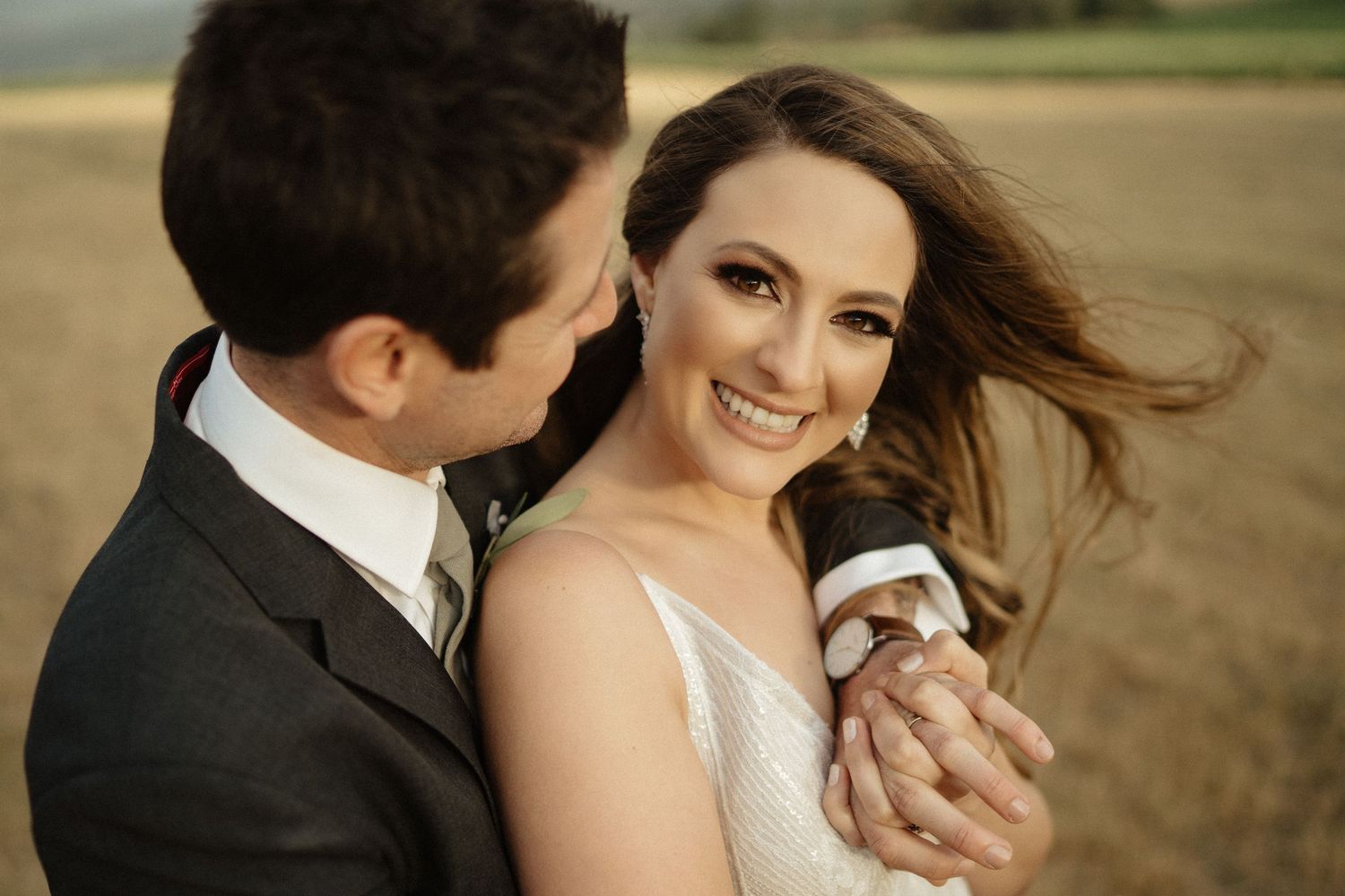 Black and white portrait of a couple sharing an intimate moment during their wedding.