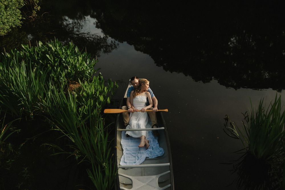 unique engagement photo in a rowboat