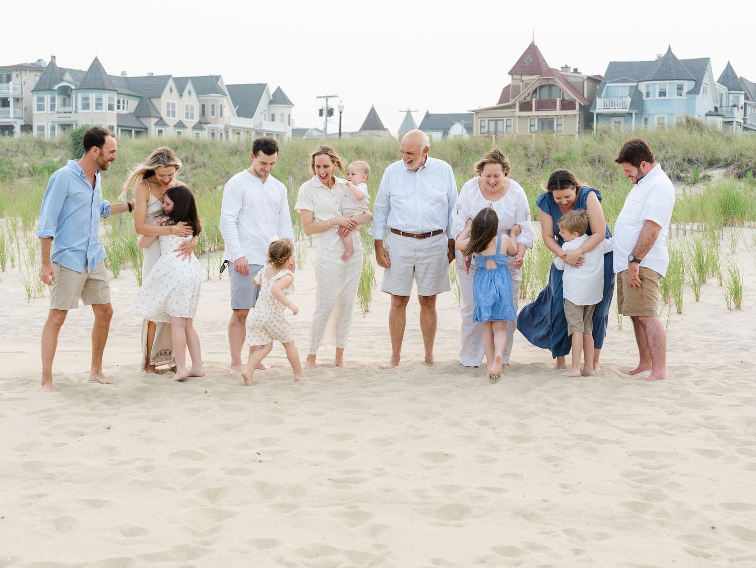 Three generations hugging together on the beach in Ocean Grove New Jersey.