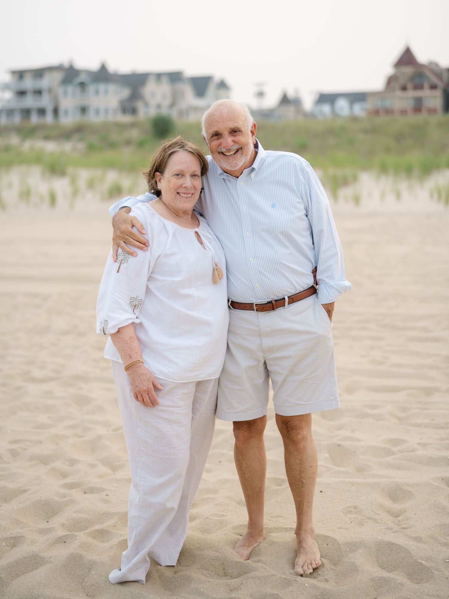 Parents celebrate their 50th wedding anniversary with a family photoshoot on the beach in monmouth county nj.