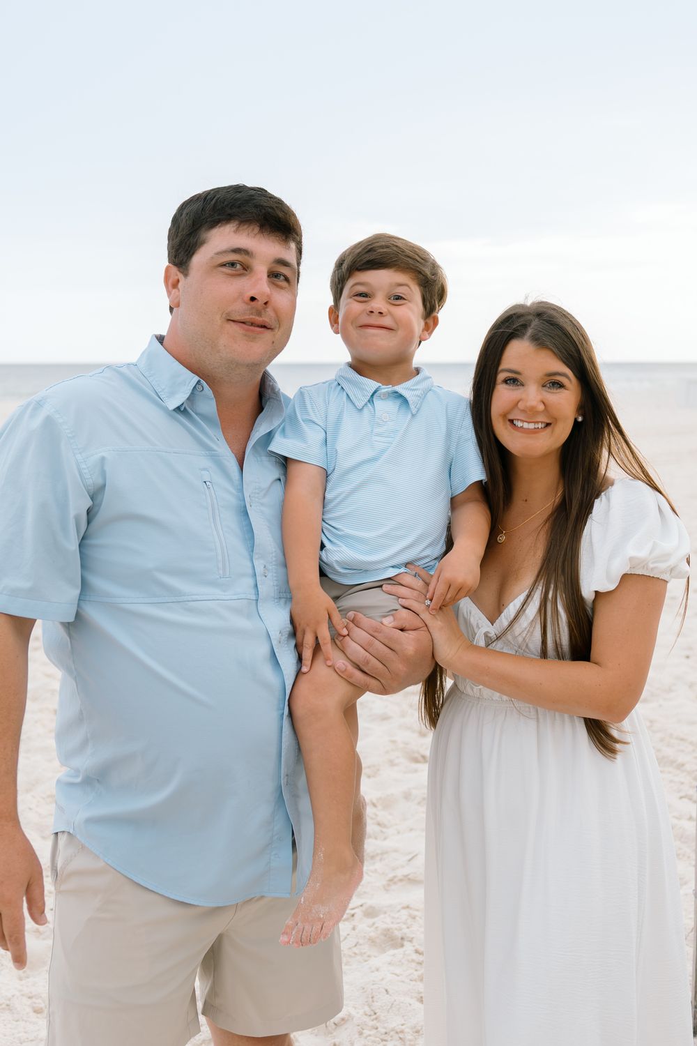Mom Dad and son picture on the beach in Gulf Shores and Orange beach Alabama.