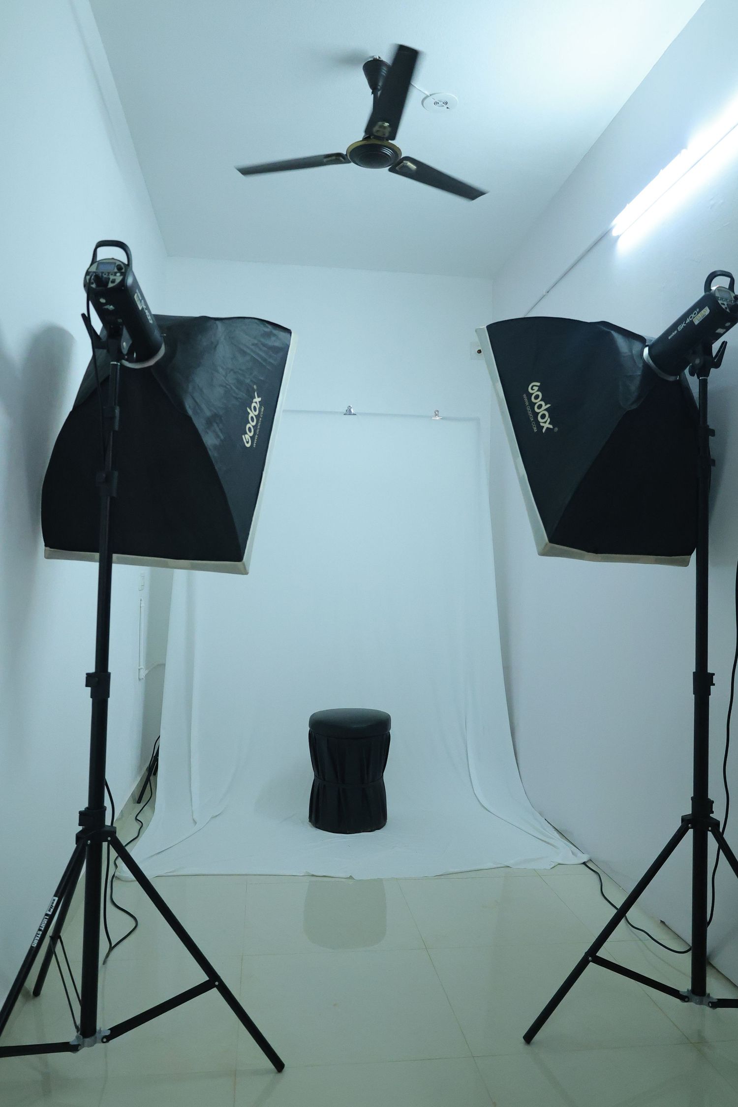Professional photography studio with softbox lights and studio equipment