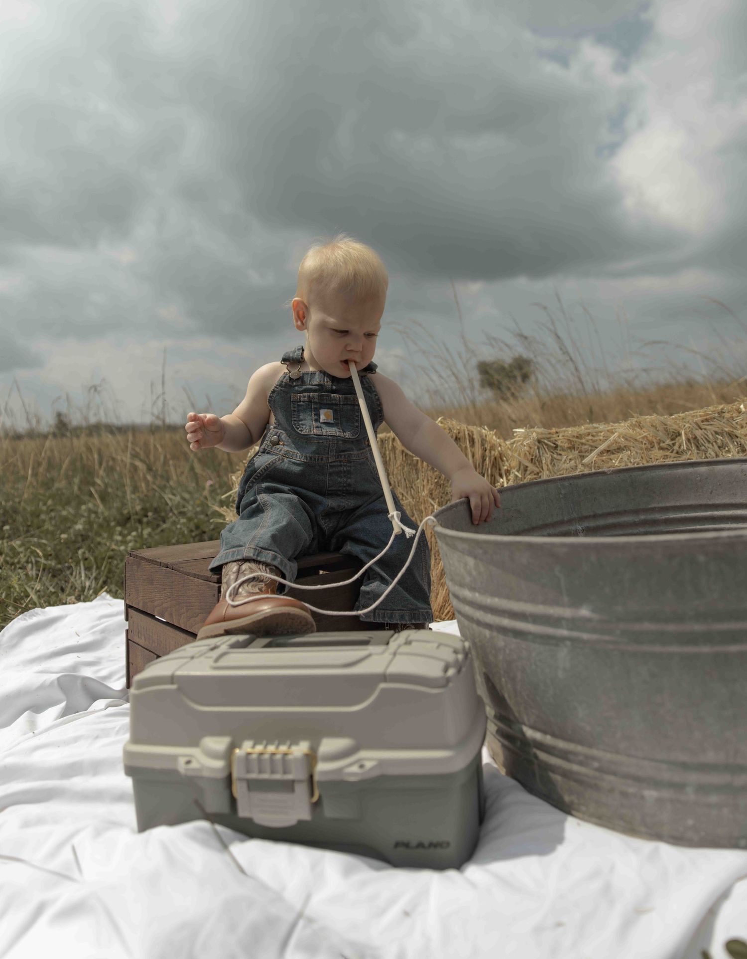 Sweet baby boy first photoshoot featuring a fishing-themed session, capturing precious moments, adorable details, and memories to treasure.