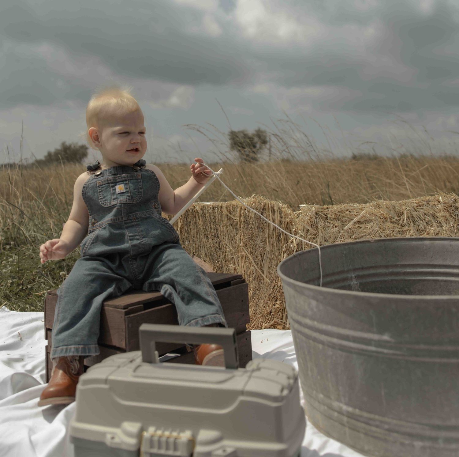 Sweet baby boy first photoshoot featuring a fishing-themed session, capturing precious moments, adorable details, and memories to treasure.