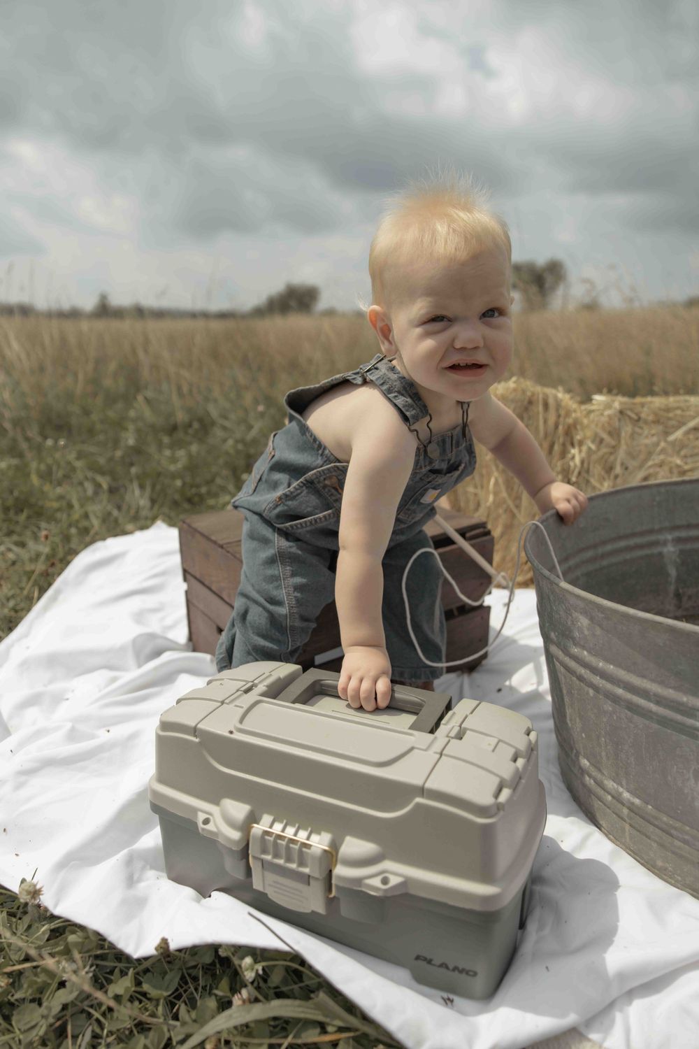 Sweet baby boy first photoshoot featuring a fishing-themed session, capturing precious moments, adorable details, and memories to treasure.