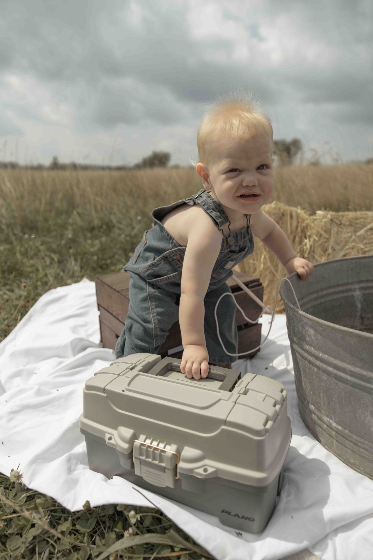 Sweet baby boy first photoshoot featuring a fishing-themed session, capturing precious moments, adorable details, and memories to treasure.