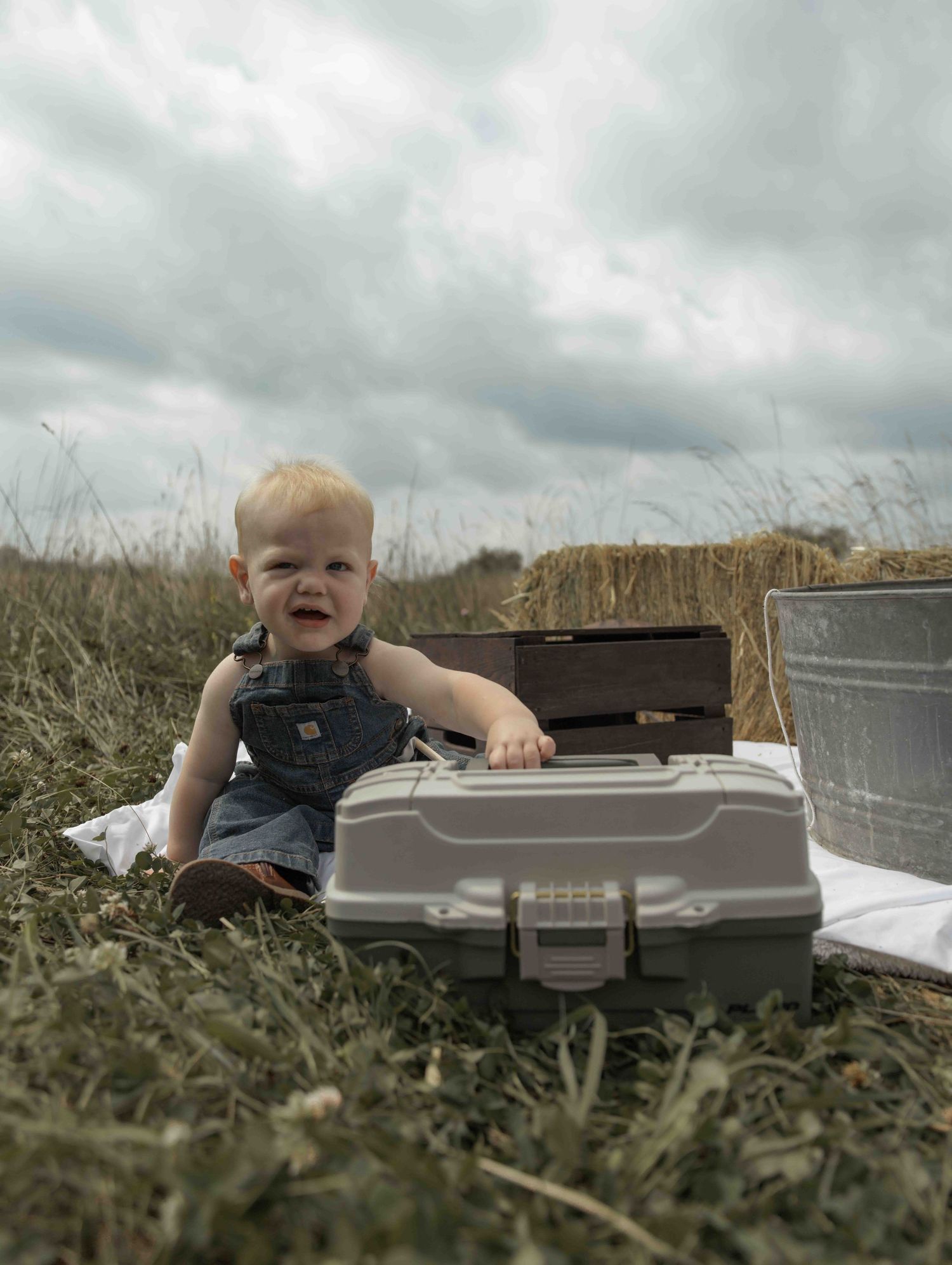 Sweet baby boy first photoshoot featuring a fishing-themed session, capturing precious moments, adorable details, and memories to treasure.