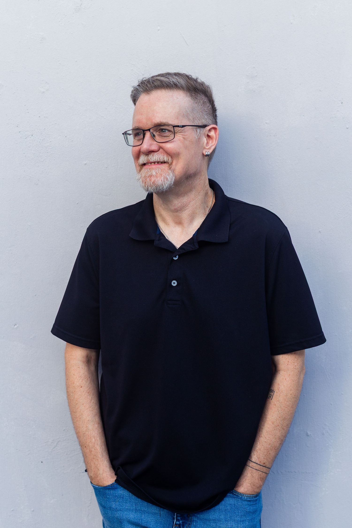 Headshot of a man against a lavender gray background. Guaynabo, Puerto Rico.
