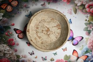 Vintage marble-patterned ceramic bowl surrounded by colorful butterflies and floral decorations on white background.
