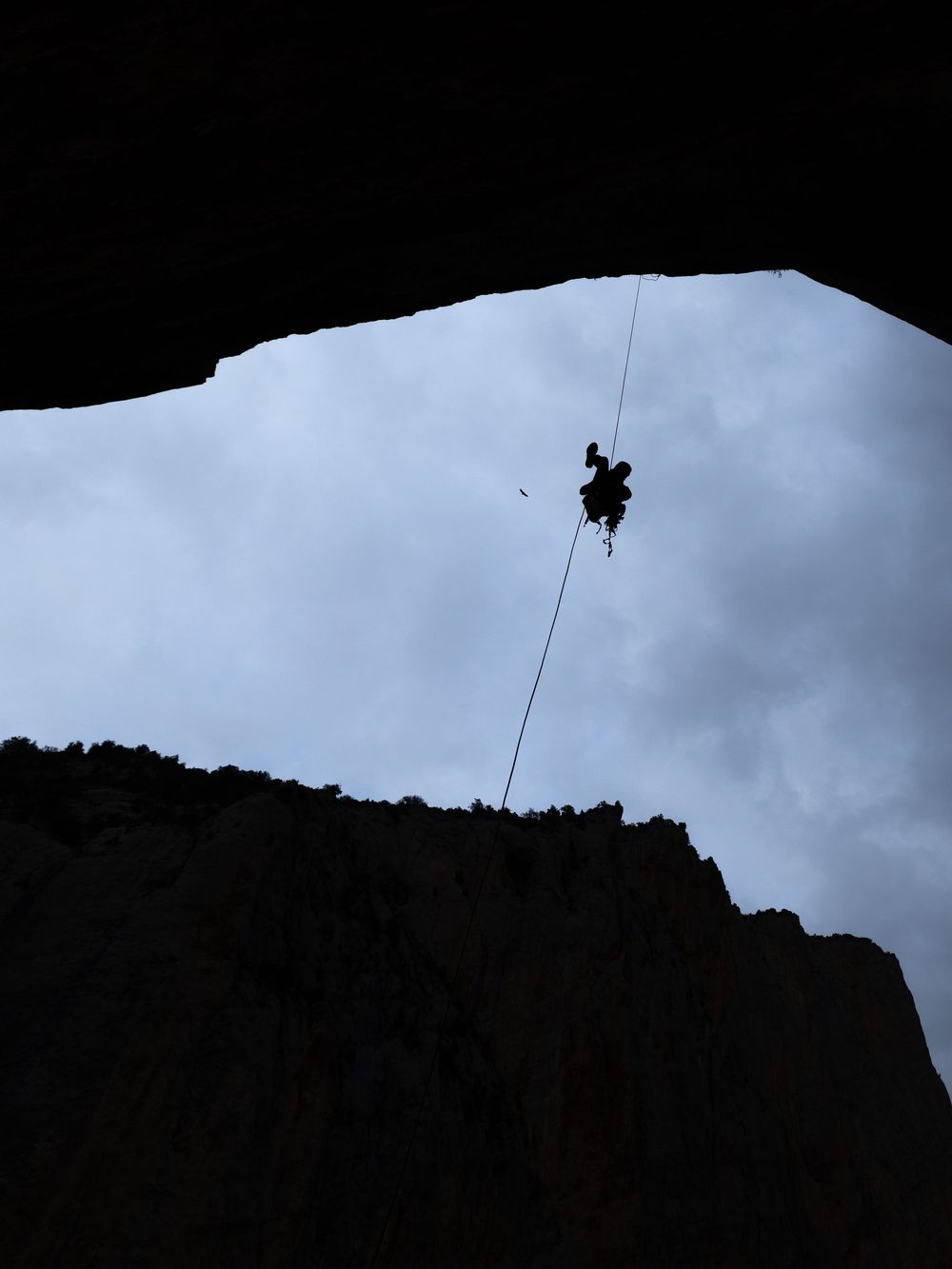 End of day on the wall, Chris Sharma's silhouetted against the sky - photo Jan Virt