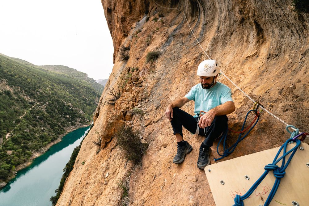 Chris Sharma resting at a belay station between attempts on his multi-pitch project, Spain. Photo Jan Virt