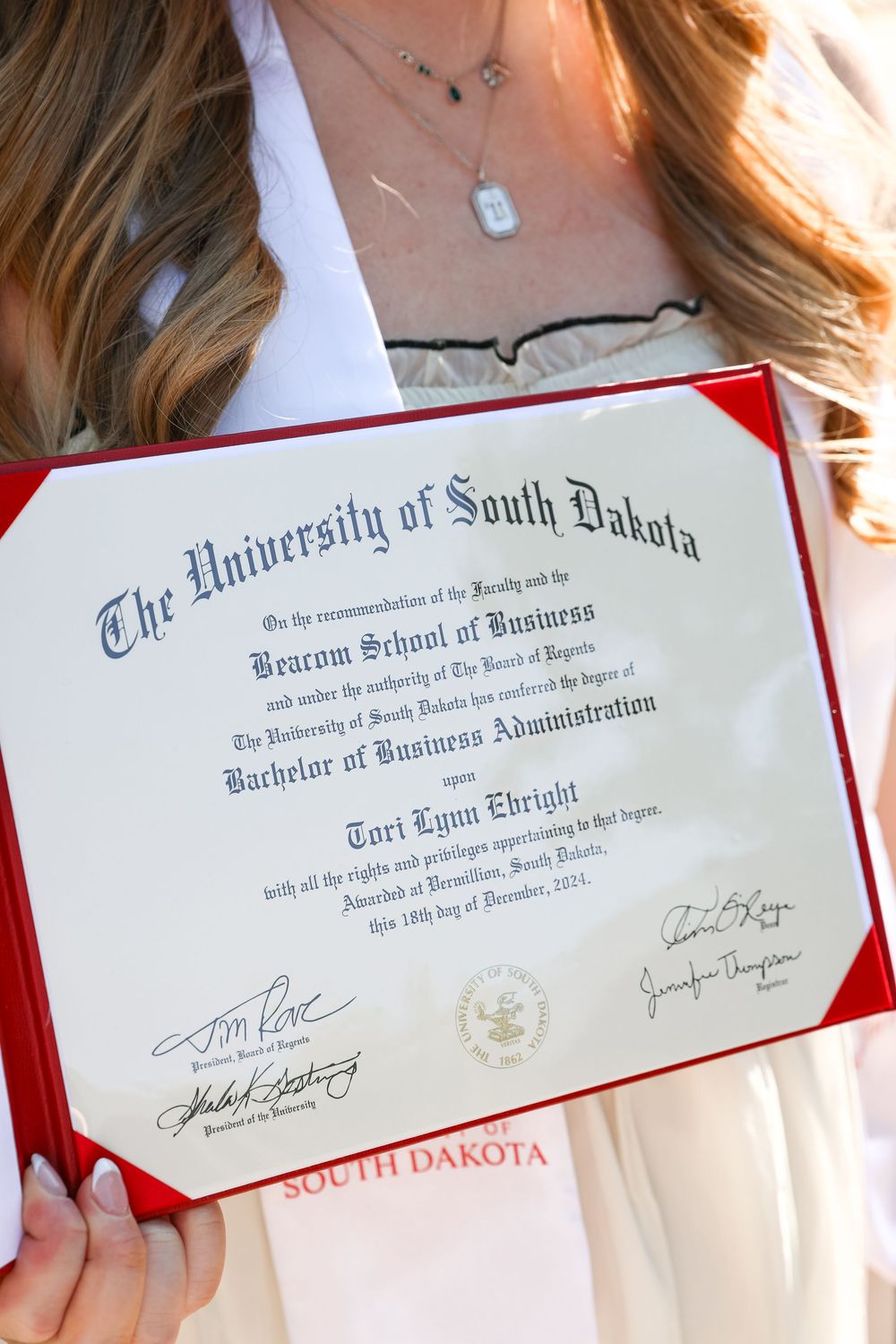 University of South Dakota Bachelor of Business Administration diploma for Tori Lynn Ebright, 2024.