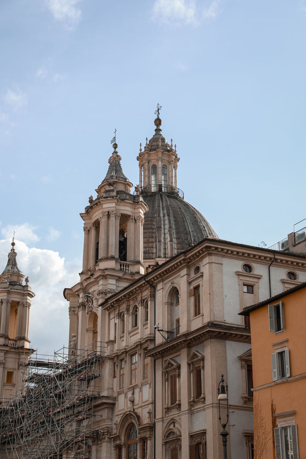 Baroque church dome and bell towers of Sant Agnese in Agone rising above Piazza Navona in Rome, Italy.