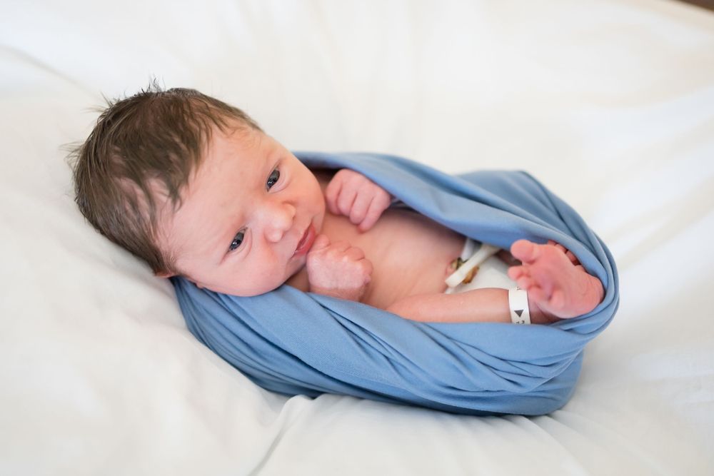 Newborn baby wrapped during a Fresh 48 Session at Fort Sanders in Knoxville, TN.