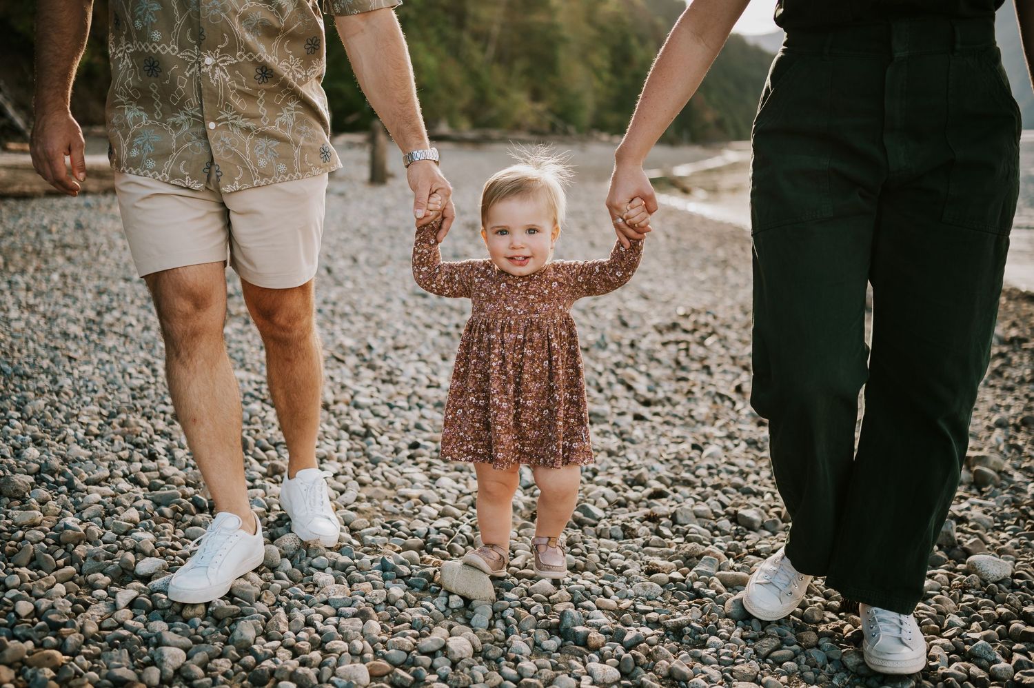 Comox Valley Photographer Portraits at Comox Lake in Cumberland, Vancouver Island. Family holding hands on rocky beach