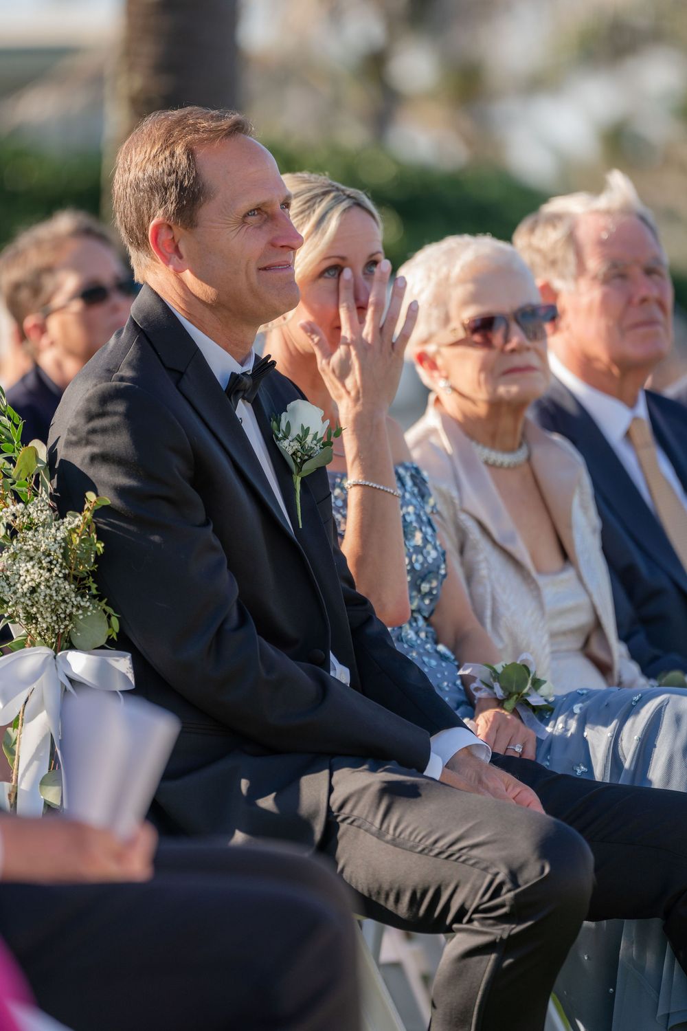 Bride's father wiping away tears during the ceremony at Lost Tree, Palm Beach, FL
