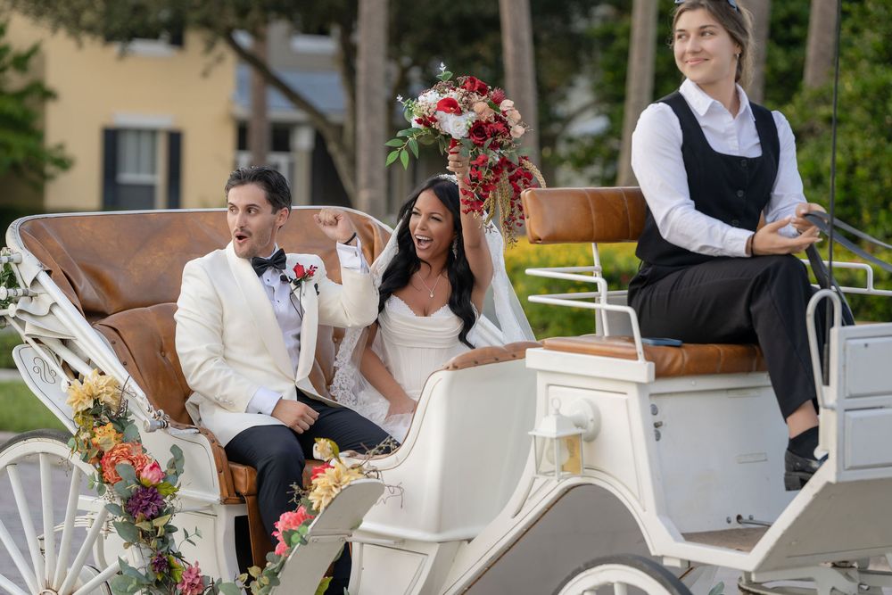 Newlyweds cheering from a horse-drawn carriage after their ceremony at Tradition Town Hall, Port St. Lucie, FL