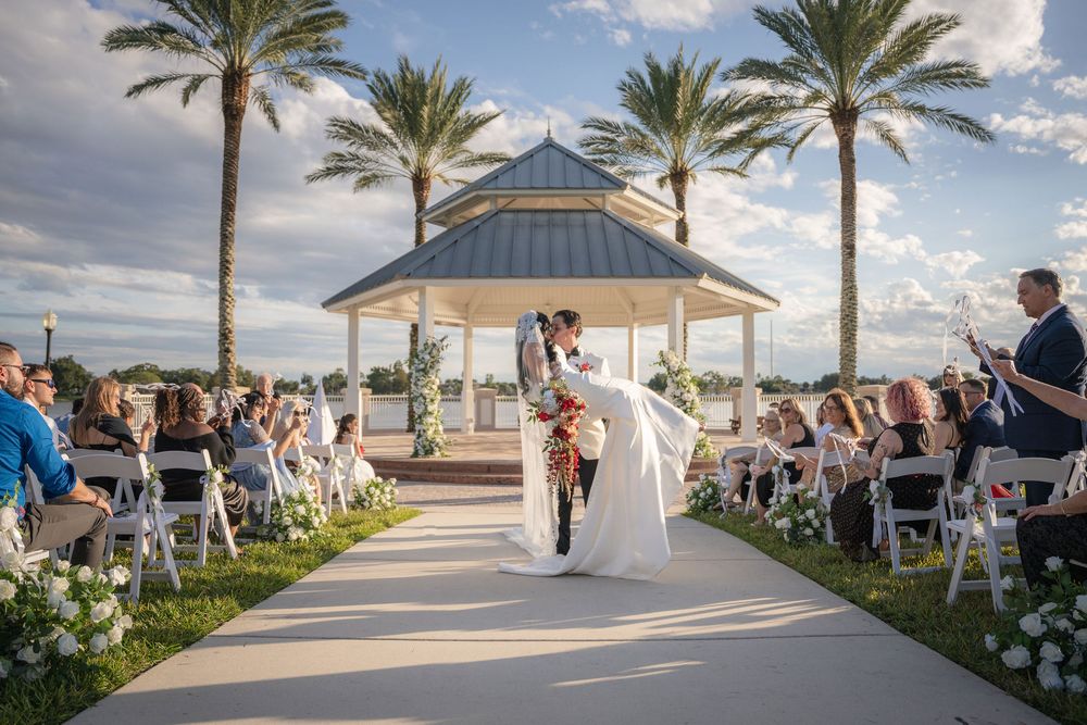 Newlyweds kissing in front of a gazebo at Tradition Town Hall, Port St. Lucie, FL