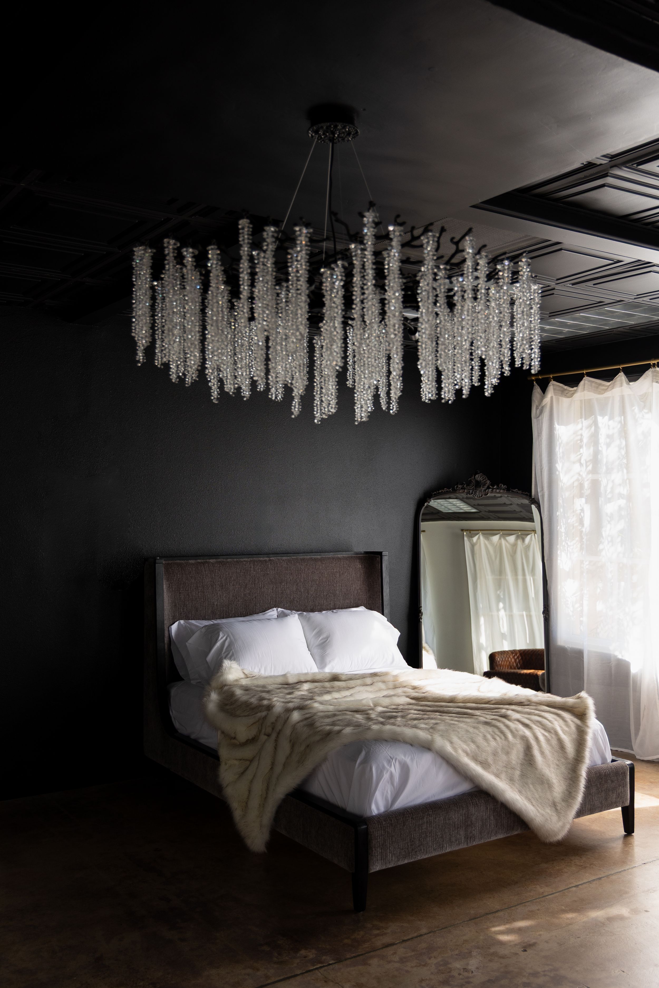 Cozy bed setup inside a luxury boudoir photography studio