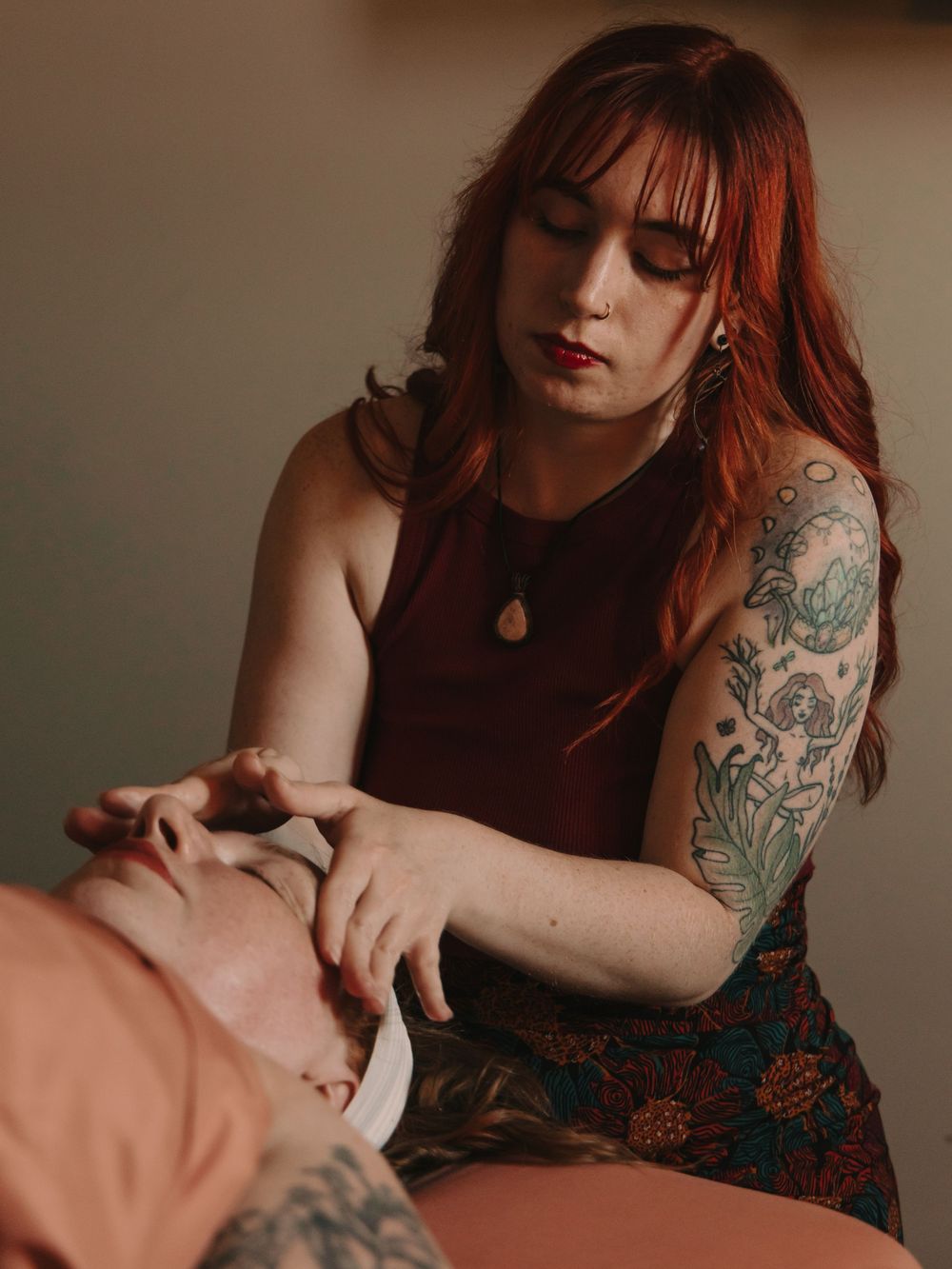 Esthetician giving a facial massage treatment