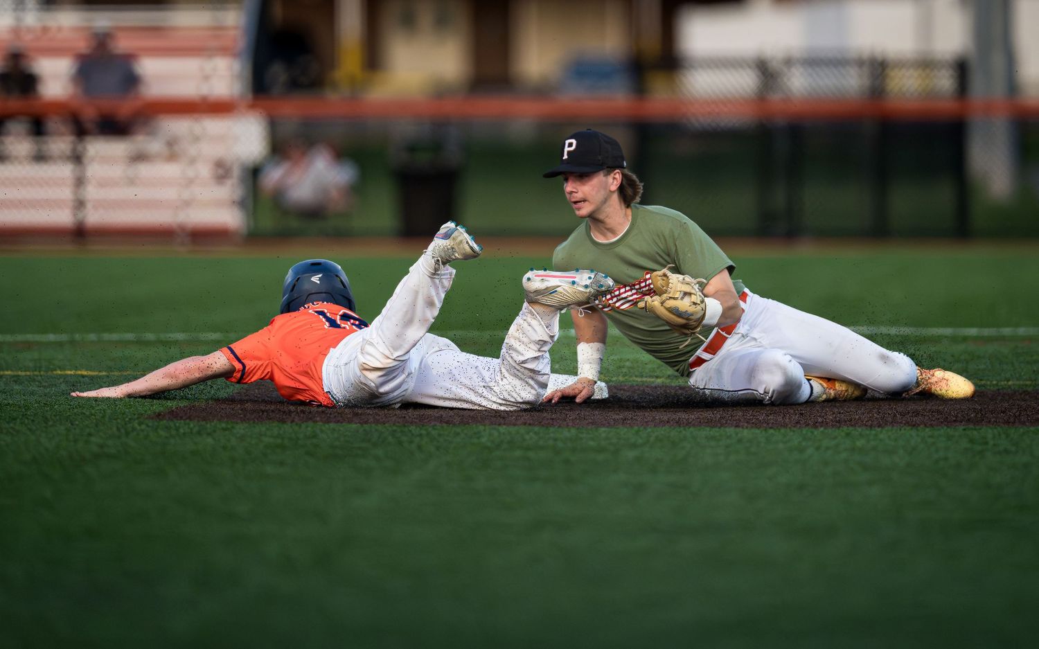 Hershey High School baseball player sliding into base against Palmyra, by Deanna Fox, SportsFox Photography, Hershey PA