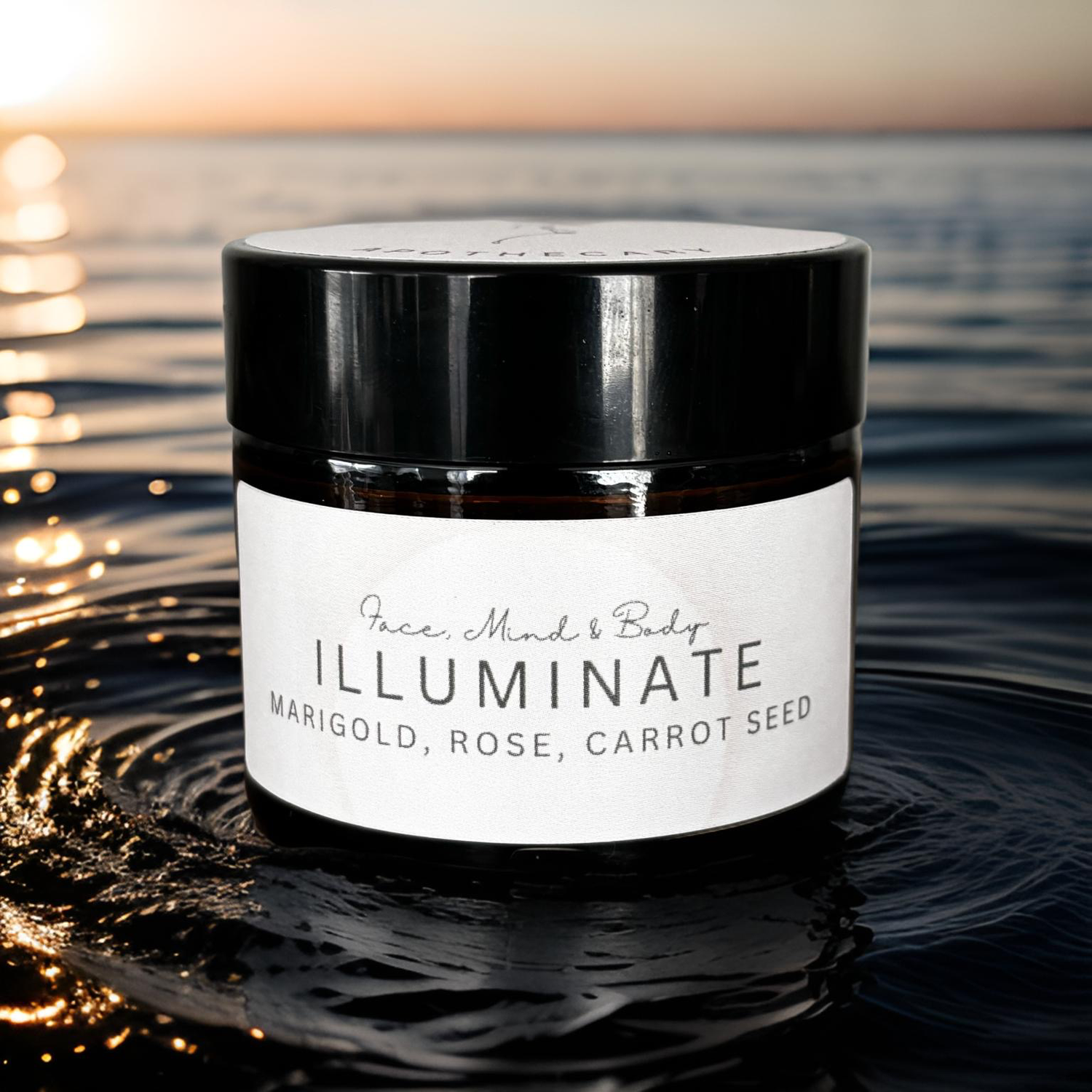 Illuminate face cream jar with marigold, rose, and carrot seed, sitting on water at sunset.