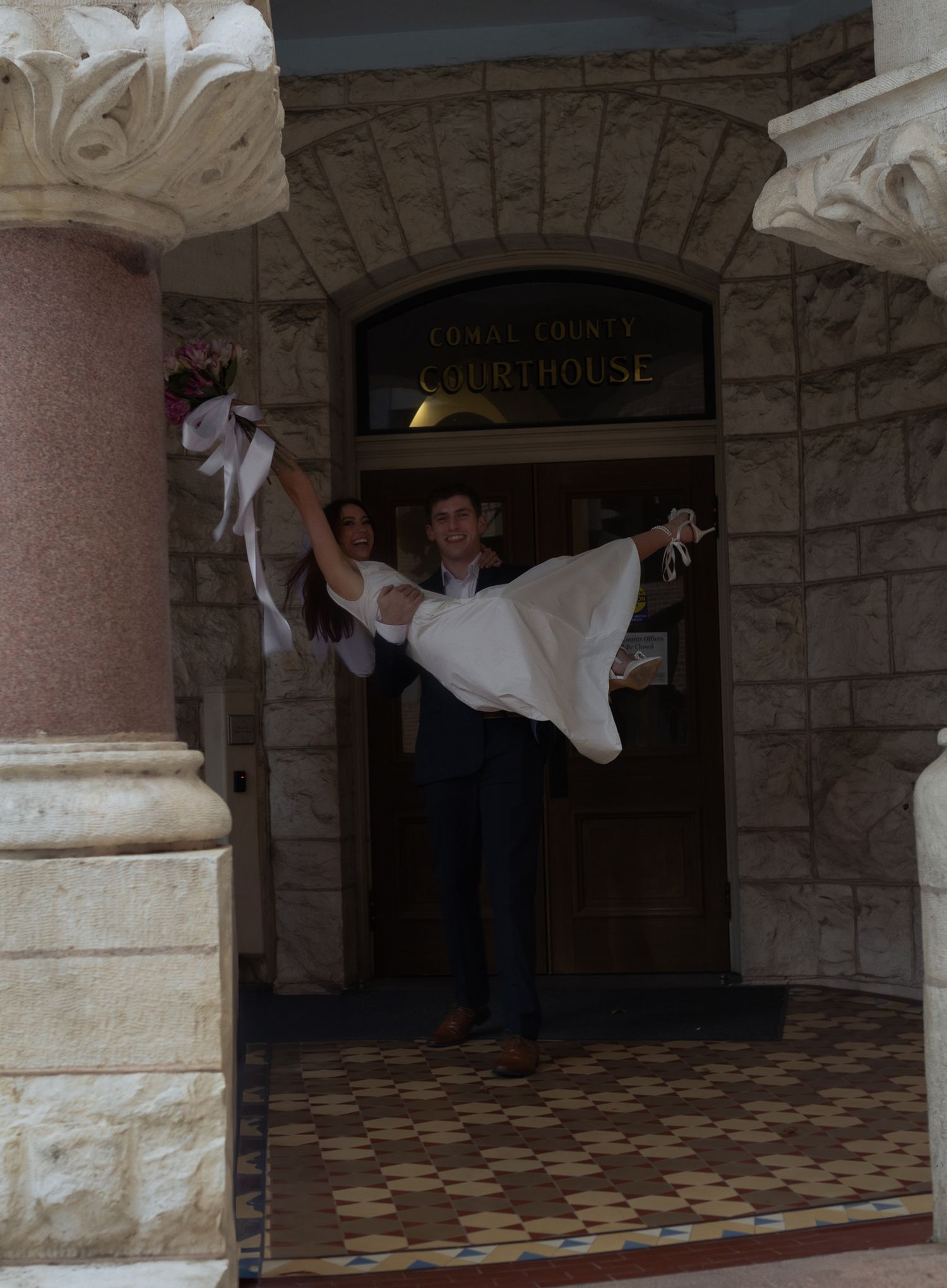Newlyweds moments after they eloped at the New Braunsfels courthouse.