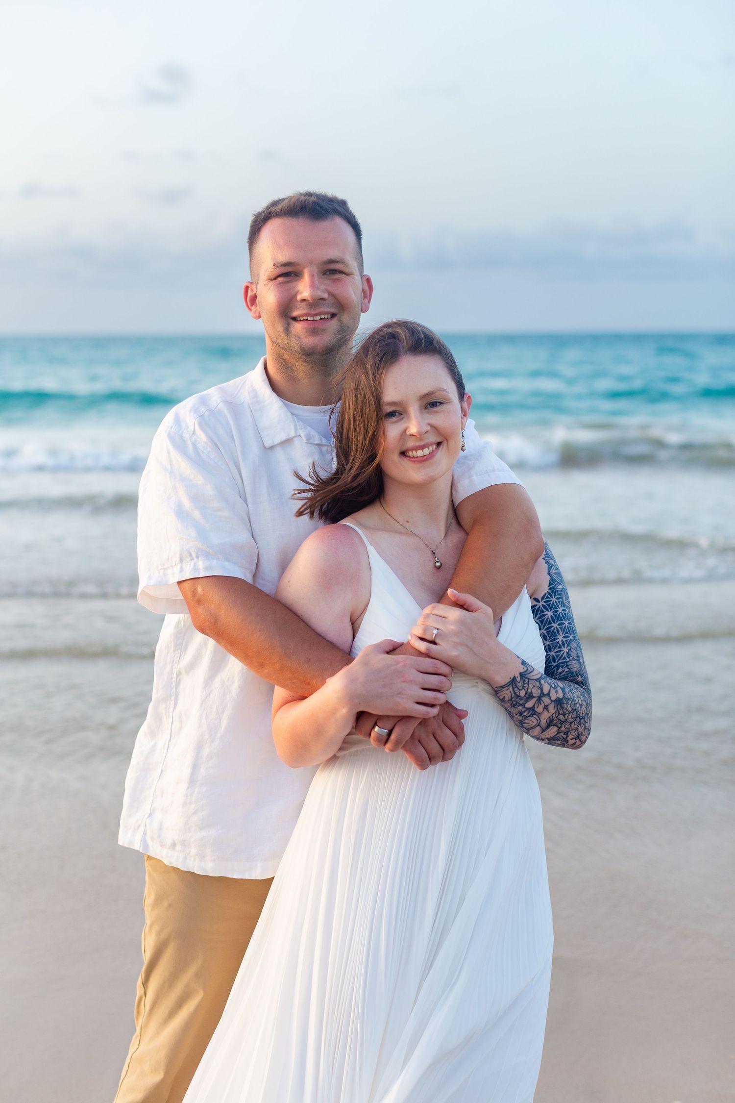 Couples portrait on the beach in Isla Verde, Carolina, Puerto Rico.