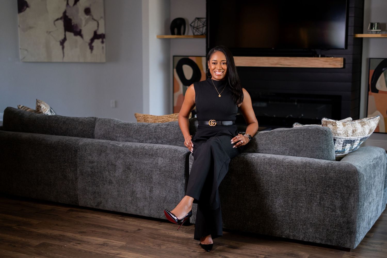 Orlando personal branding photographer Ray Alvarez — interior designer Brandy in white outfit with pink heels during on location branding se
