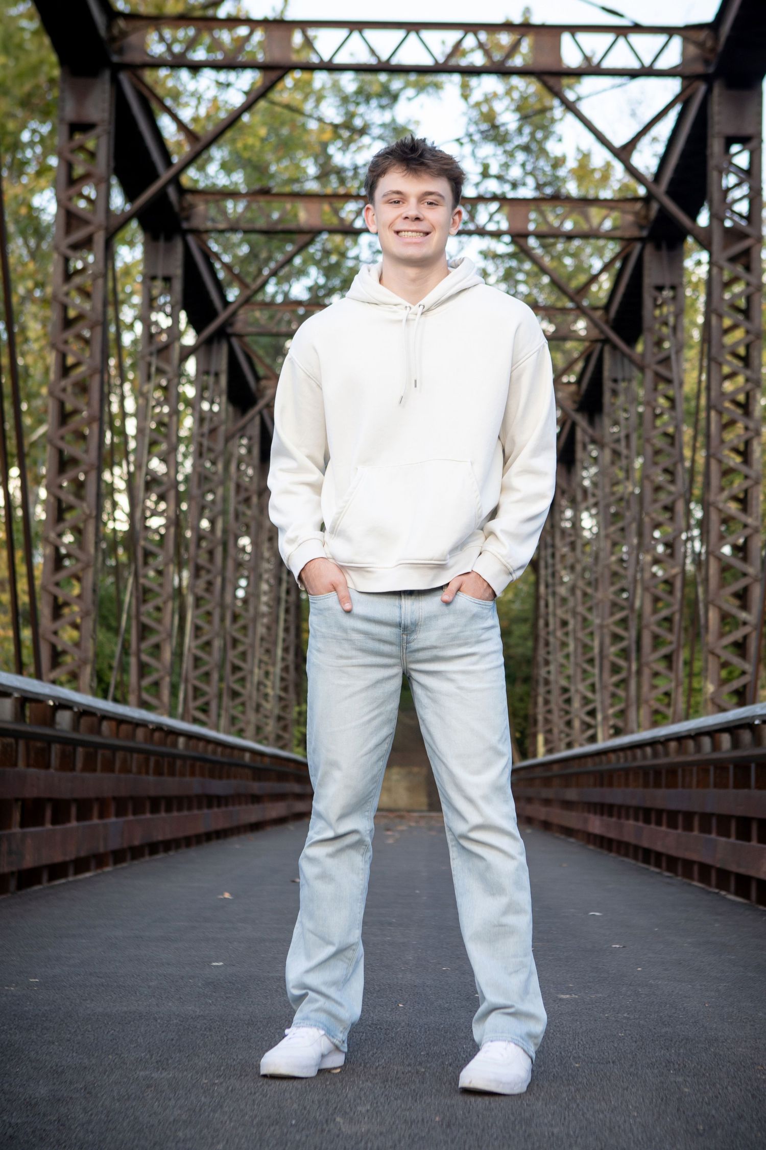 Senior pictures at Quarry Metro Park in Columbus Ohio featuring Grandview Heights senior with an old metal bridge and nature backdrops.