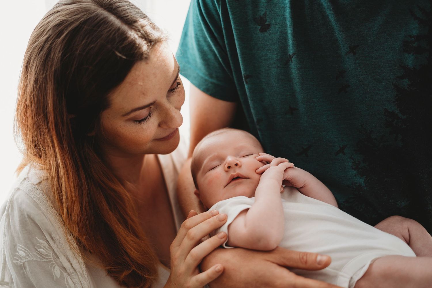 Parents holding newborn baby, Edinburgh newborn photographer