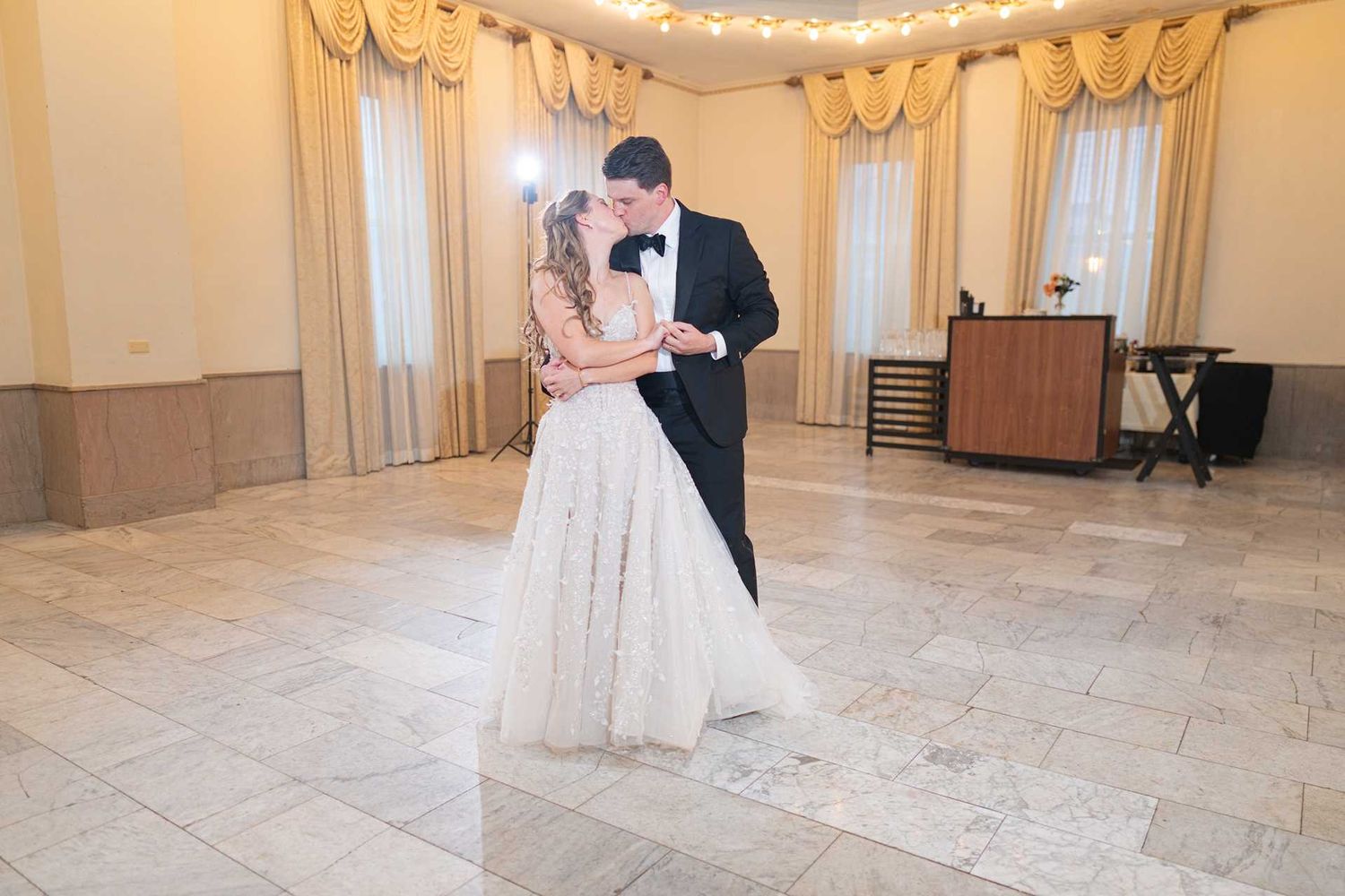 Bride and groom share their first dance in an elegant ballroom at The Westin Great Southern Columbus Wedding Venue