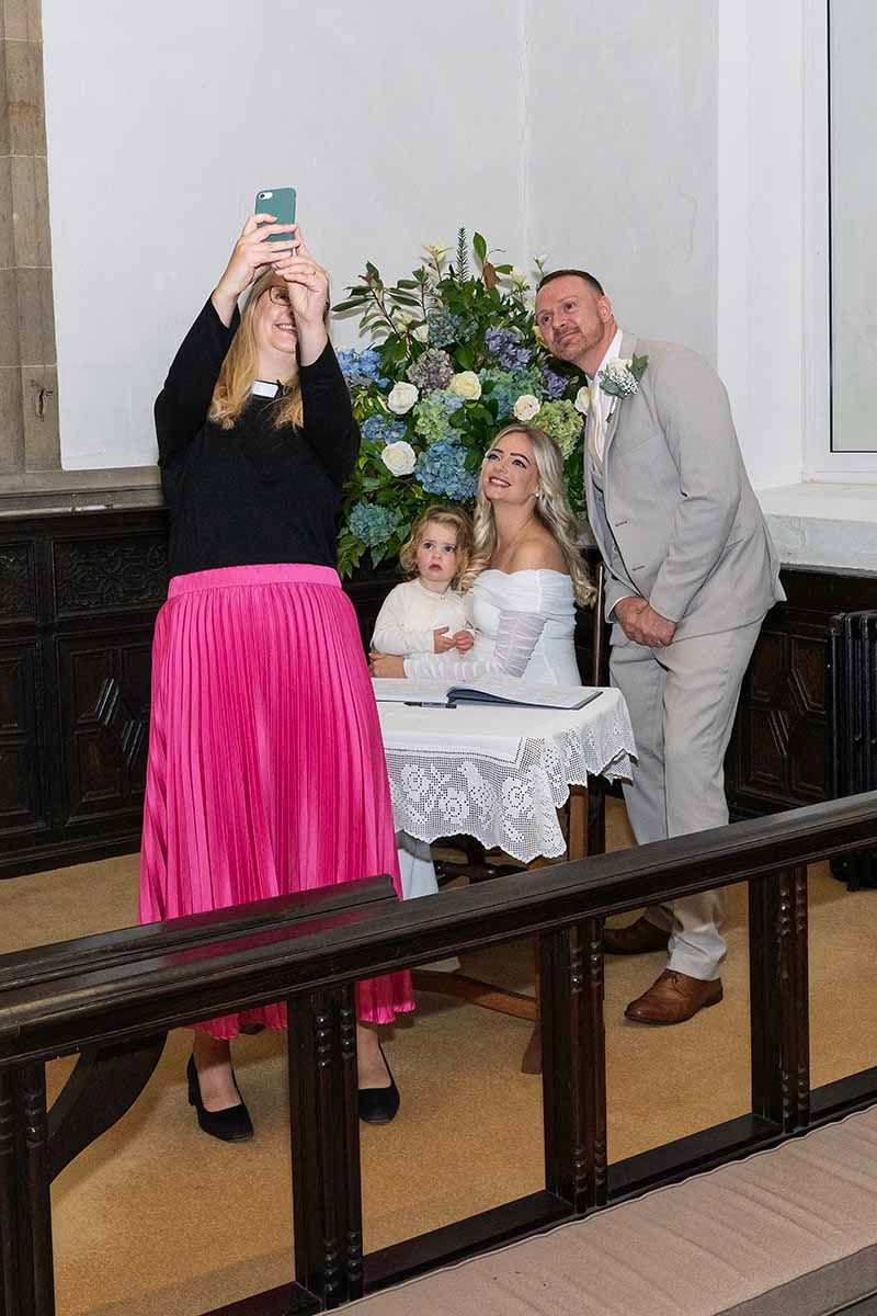 The priest takes a selfie at Jamie & Anna's Lake District elopement wedding