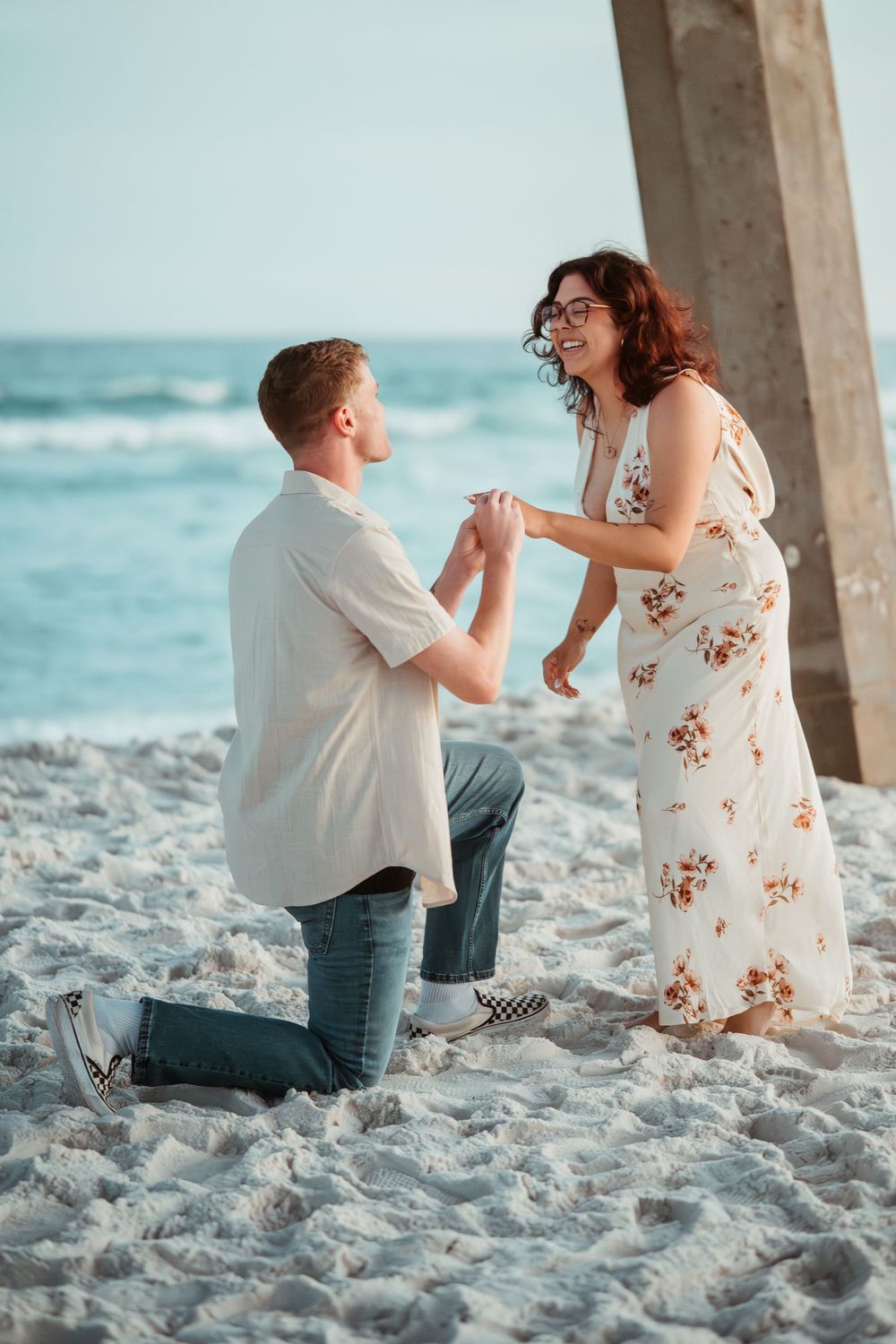 Surprise marriage proposal beneath the pier on Pensacola Beach