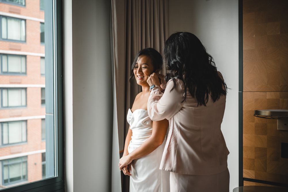 Getting ready scene near window with soft natural lighting.