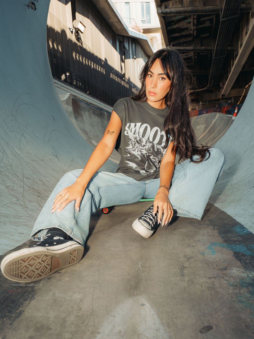 Series of low-angle shots showing worn skate shoes and concrete floor in an urban setting.