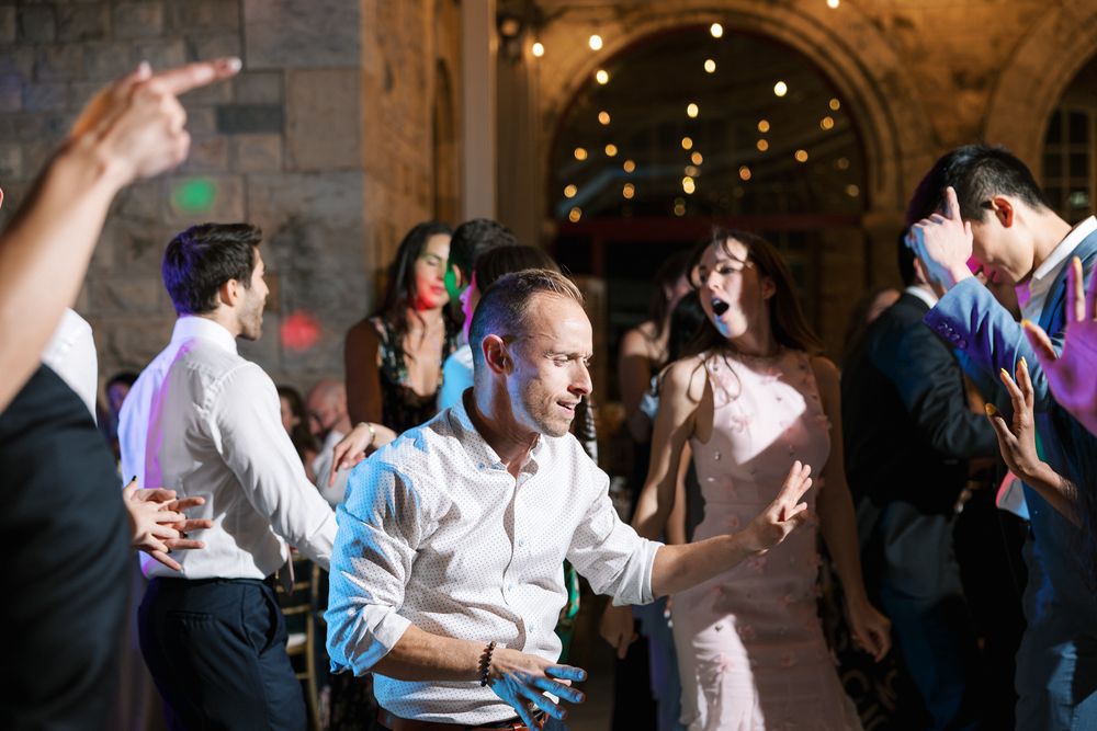 Energetic wedding party with guests dancing and enjoying the night in Portugal