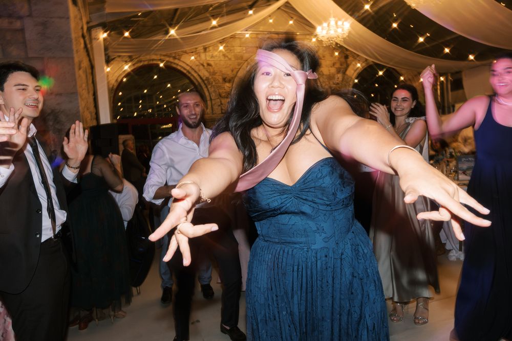 Energetic wedding dance floor with guests having fun in Portugal