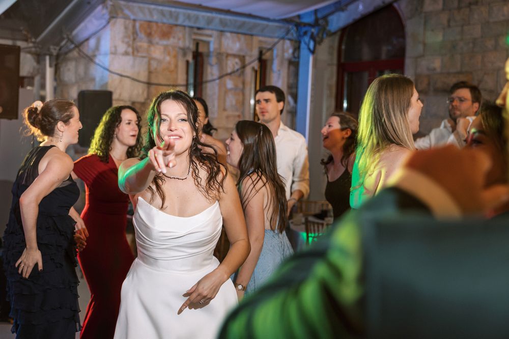 Guests dancing and celebrating during wedding party at Forte da Cruz in Cascais Portugal