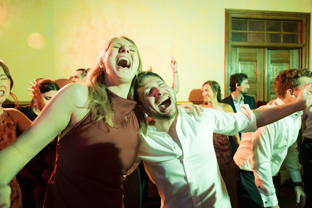 Guests enjoying lively dance floor moments during wedding reception in Portugal