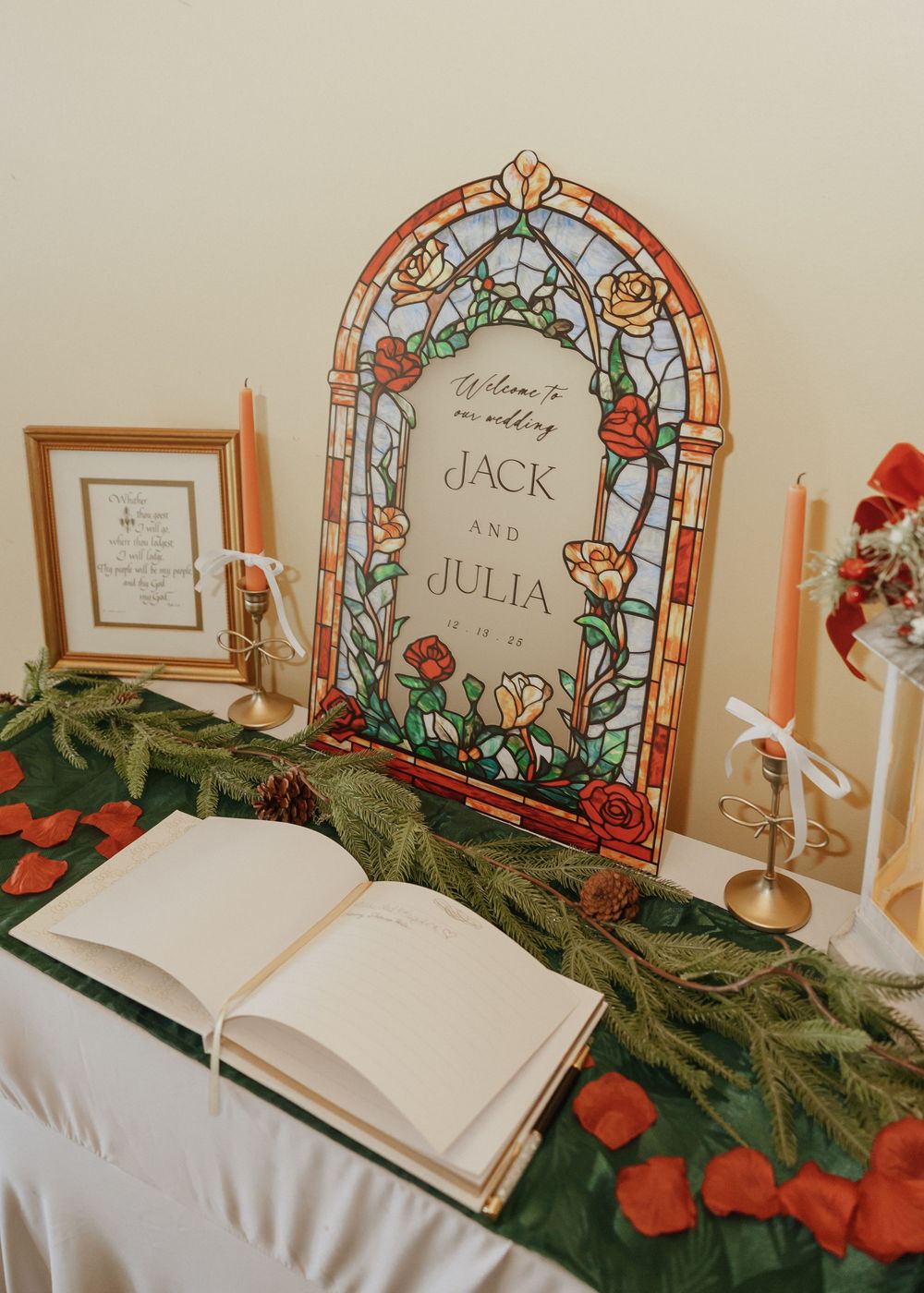 Wedding welcome sign with stained glass design for Jack and Julia on decorated table.