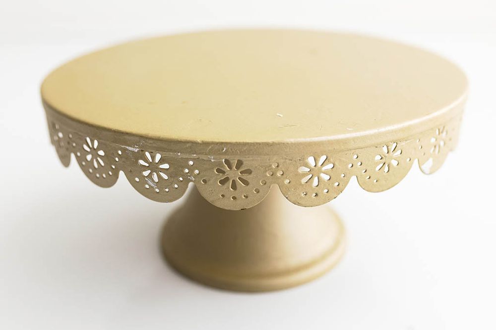 Gold metal cake stand for baby's birthday photoshoot in Temecula CA.