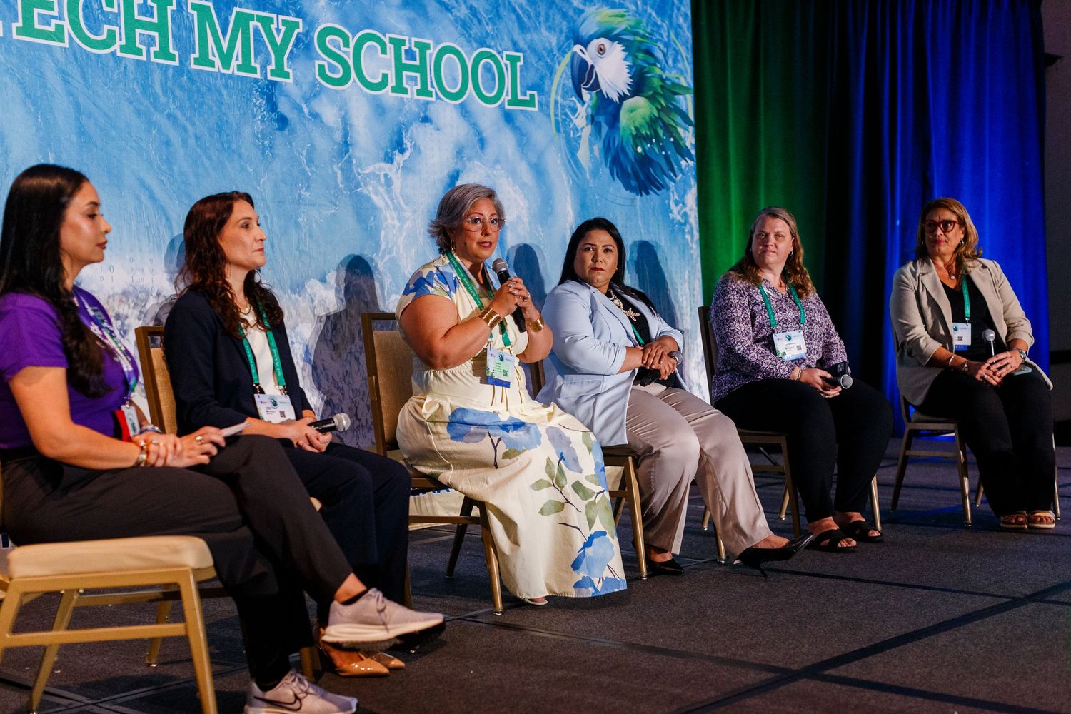 Speaker panel on stage at the Spring Educators Conference held at the Wyndham Grand Rio Mar in Rio Grande, Puerto Rico.