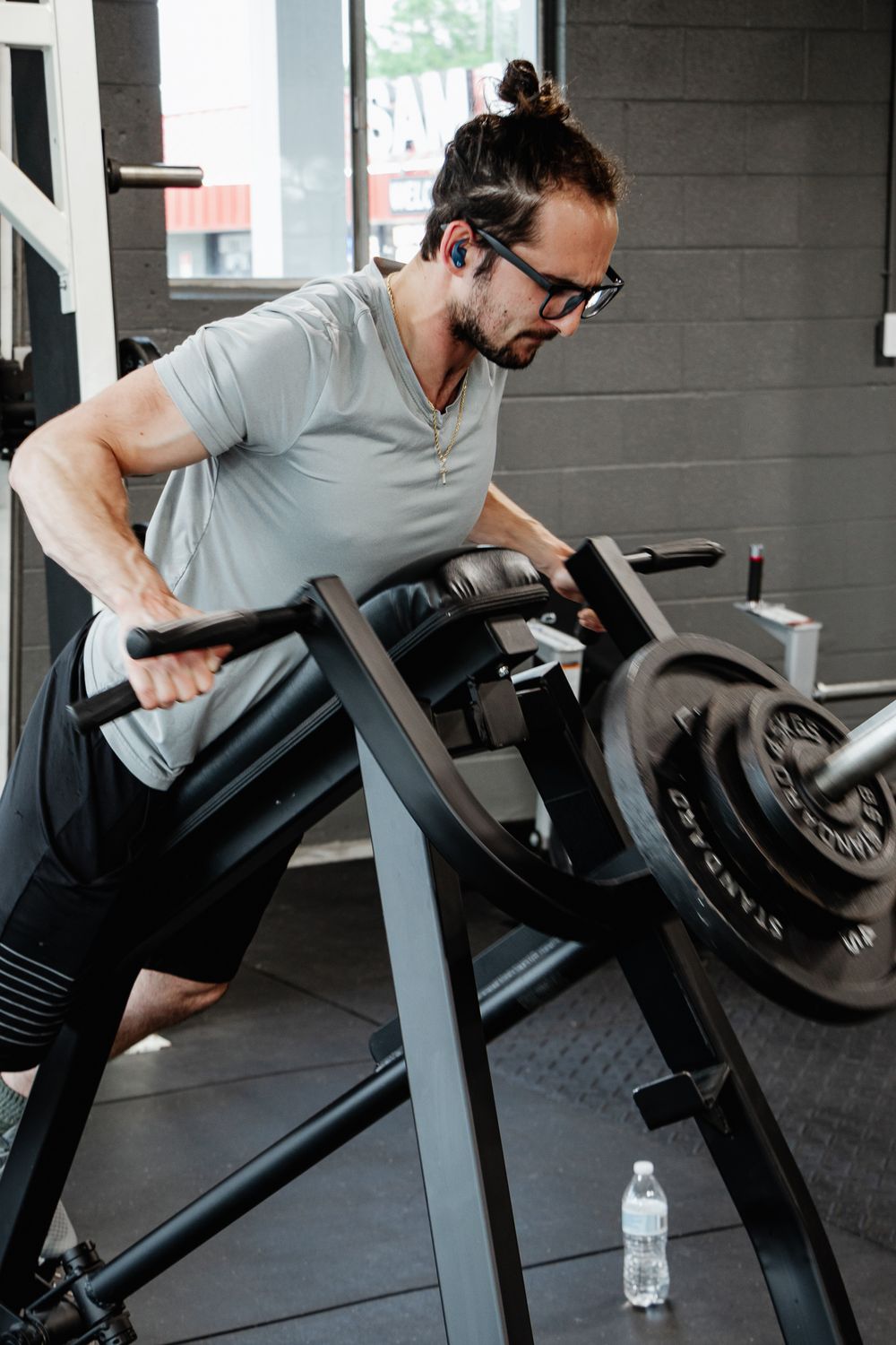 Man using a plate-loaded chest-supported row machine