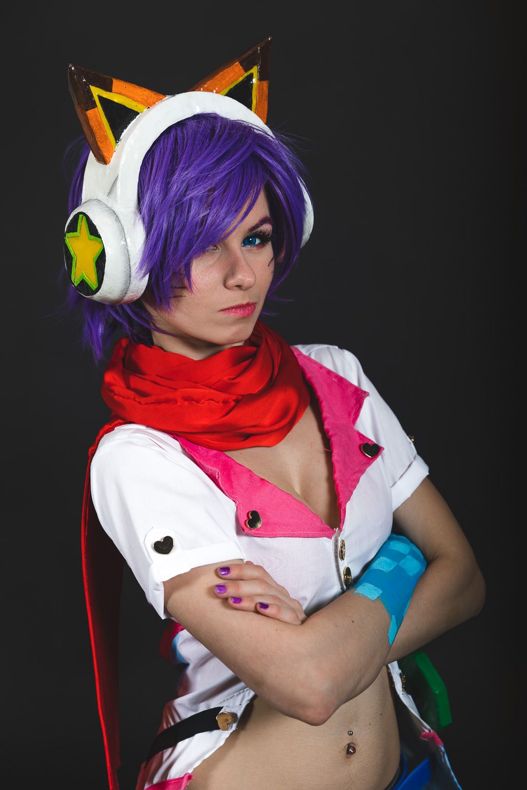 Cosplay character with purple hair wearing white outfit and fox-ear headphones.