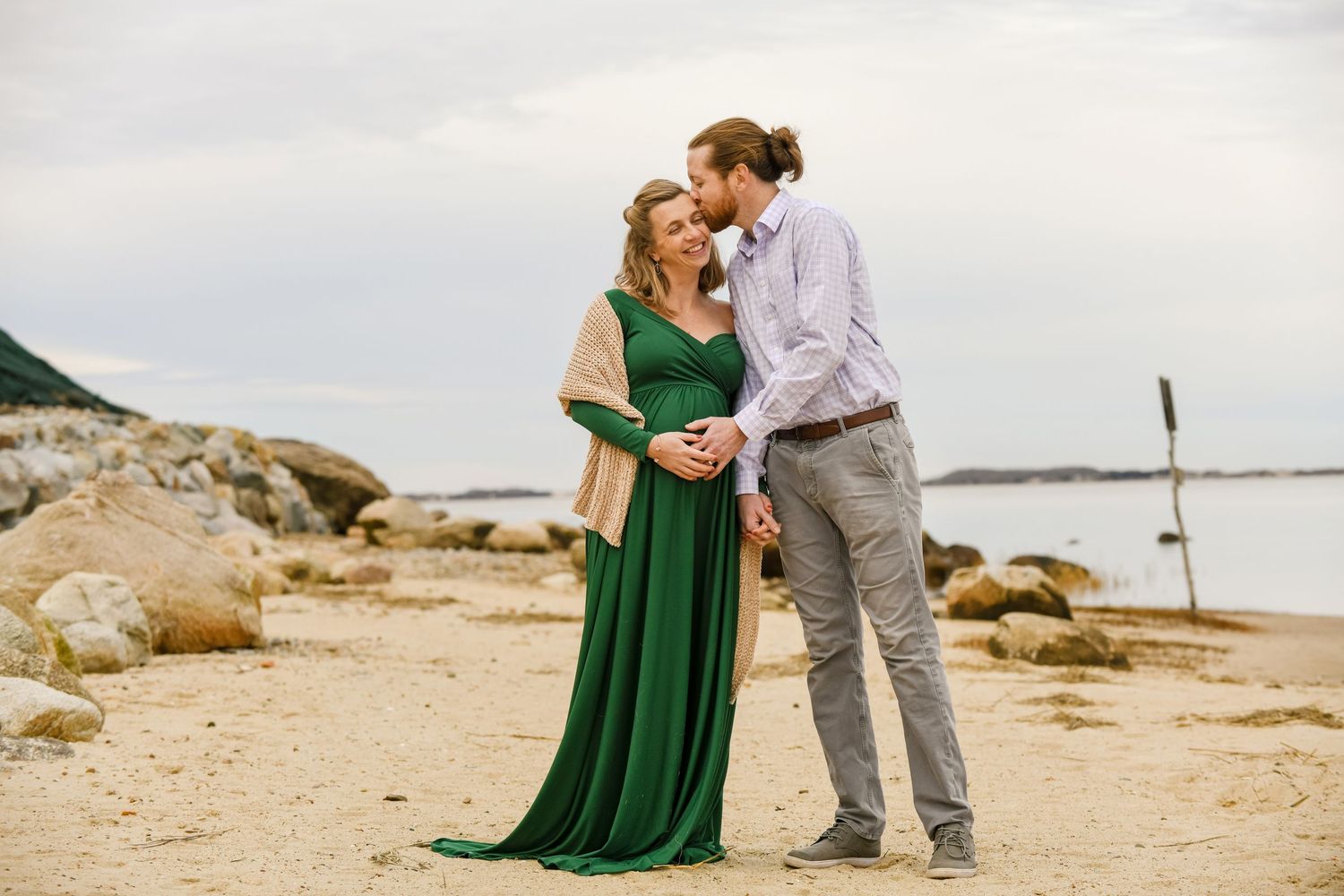 A couple have a maternity photo session at Scudder Lane landing on Cape Cod.