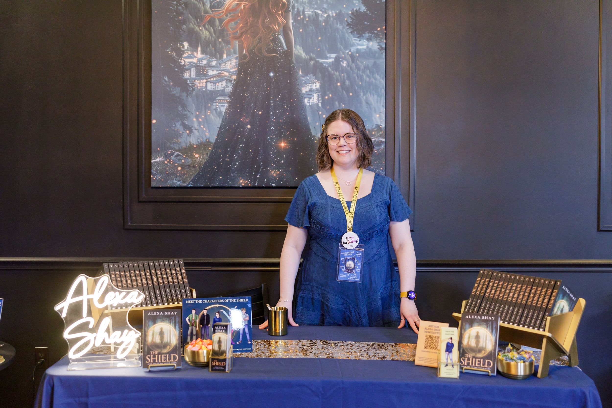 indie book author Alexa Shay author signing event in Seattle, WA bookstore lifestyle headshot standing in front of display signing table