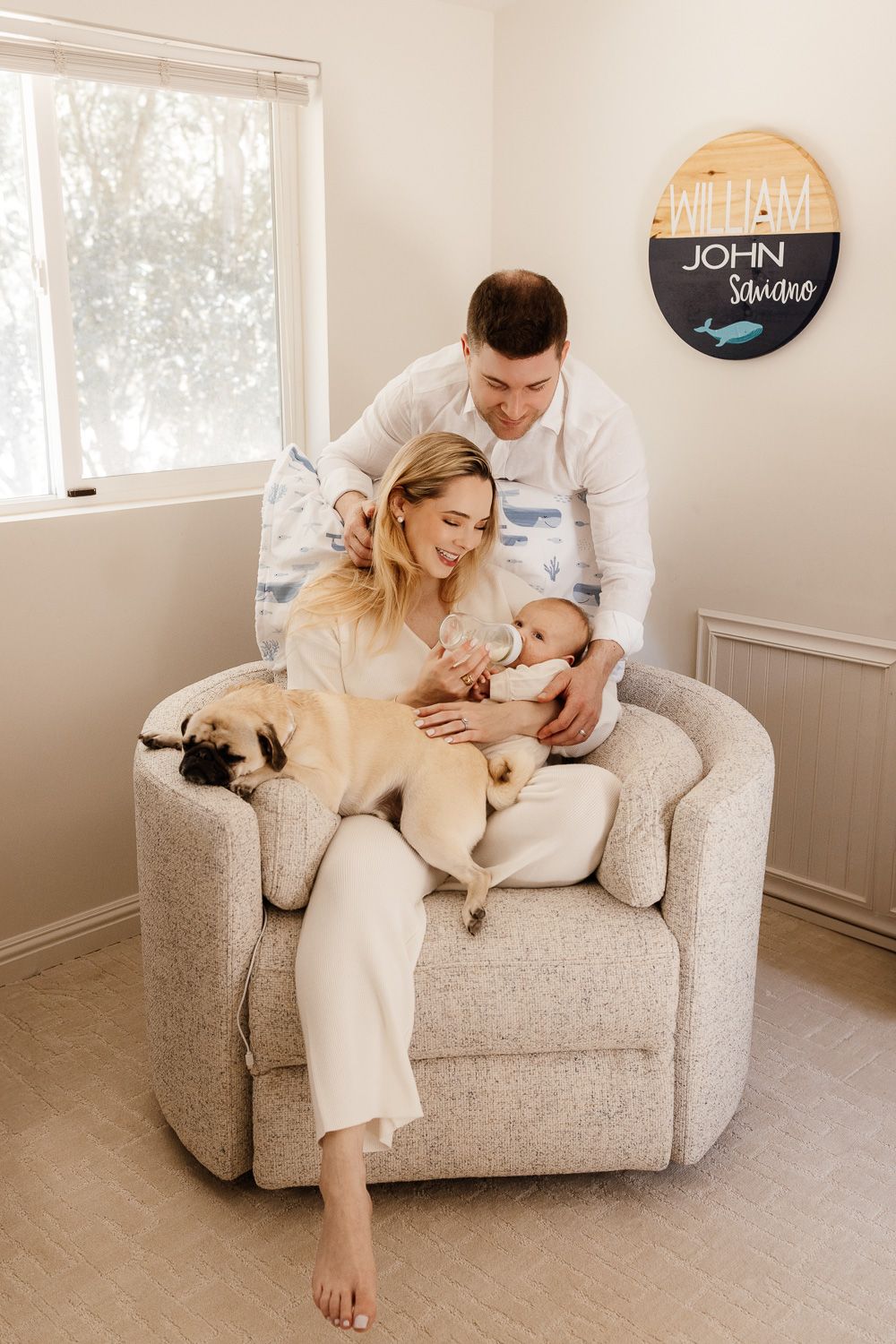 Los Altos Hills family feed their newborn in the nursery during their in-home photo session