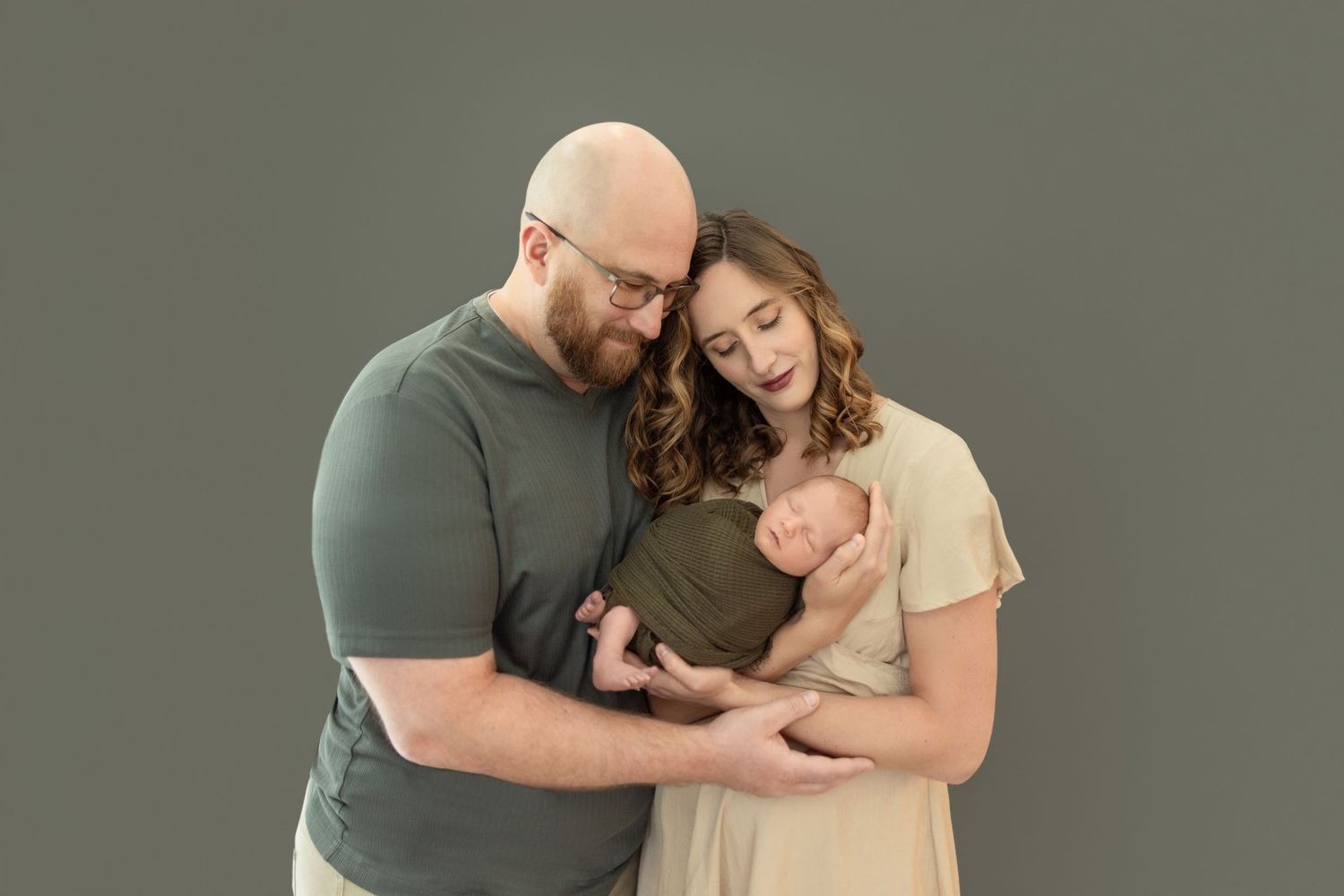 Minimalist studio family photography with muted earth tone color palette.